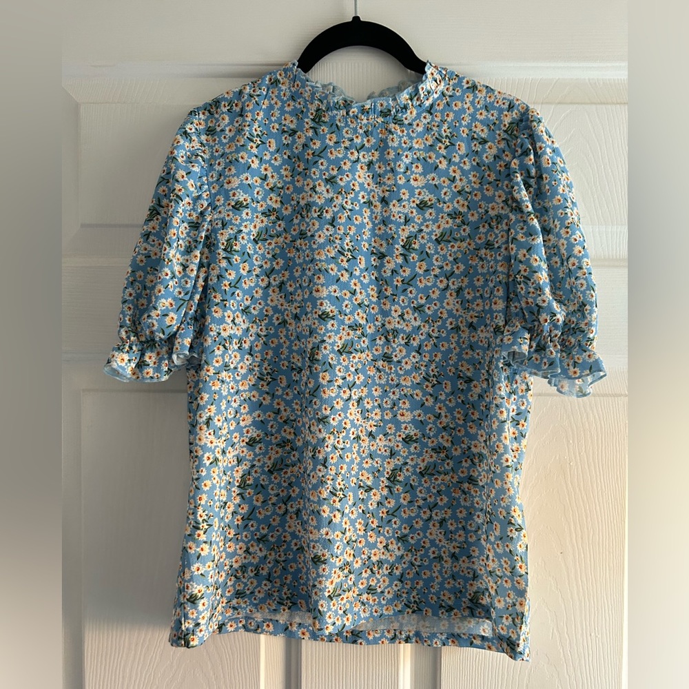 Light blue floral print short sleeve blouse with ruffle collar and cuffs